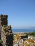 SX14409 Manorbier bay past castle wall.jpg